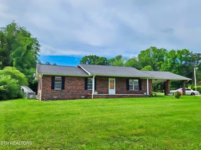 232 Kimberly Rd, Lafollette, TN 37766 - ranch-style house with a front lawn, brick siding, and cooling unit