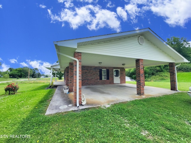 232 Kimberly Rd, Lafollette, TN 37766 - view of side of property featuring a yard, a patio, a carport, and brick siding