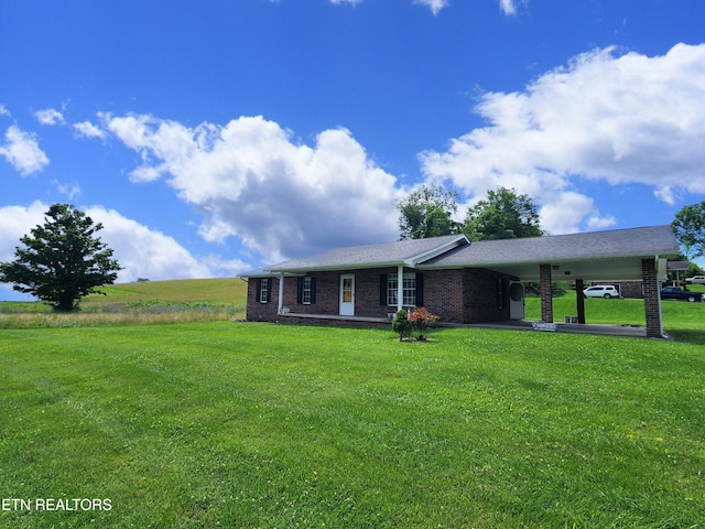 232 Kimberly Rd, Lafollette, TN 37766 - single story home featuring an attached carport, a front lawn, and brick siding