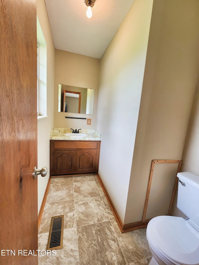 232 Kimberly Rd, Lafollette, TN 37766 - half bathroom with toilet, vanity, and baseboards