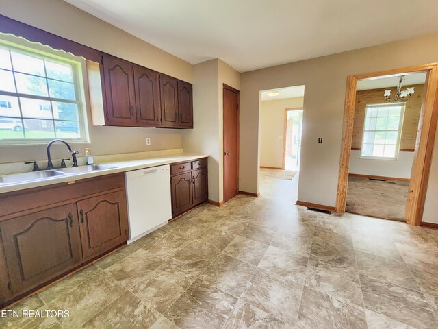 232 Kimberly Rd, Lafollette, TN 37766 - kitchen with dishwasher, a sink, a chandelier, light countertops, and baseboards