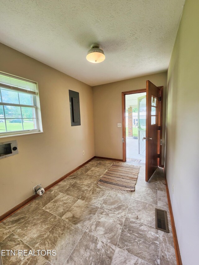 232 Kimberly Rd, Lafollette, TN 37766 - foyer with electric panel, baseboards, and a textured ceiling