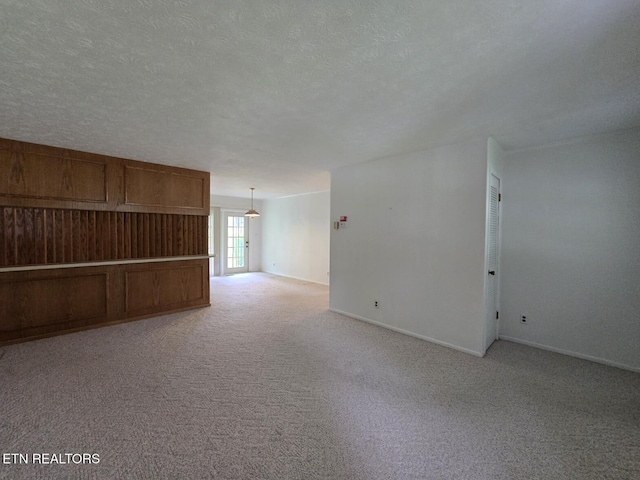 114 Verdun Rd, Oneida, TN 37841 - spare room featuring light carpet, baseboards, and a textured ceiling