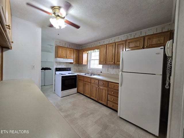 114 Verdun Rd, Oneida, TN 37841 - kitchen featuring freestanding refrigerator, range with electric cooktop, independent washer and dryer, under cabinet range hood, and a sink