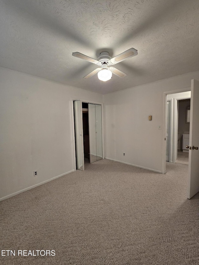 114 Verdun Rd, Oneida, TN 37841 - empty room with light colored carpet, baseboards, ceiling fan, and a textured ceiling