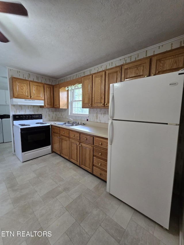 114 Verdun Rd, Oneida, TN 37841 - kitchen with freestanding refrigerator, electric stove, under cabinet range hood, brown cabinetry, and light countertops