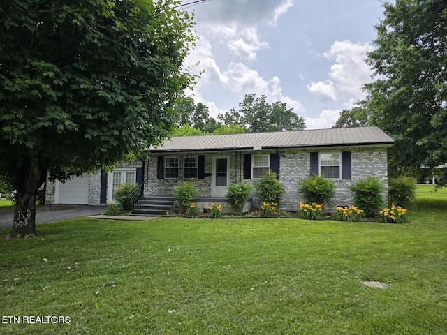 114 Verdun Rd, Oneida, TN 37841 - ranch-style house featuring a porch, driveway, a front lawn, an attached garage, and metal roof