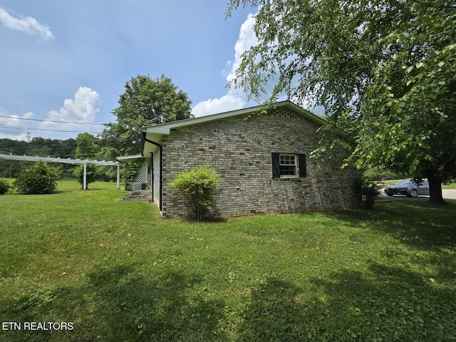 114 Verdun Rd, Oneida, TN 37841 - view of side of home with a yard, cooling unit, and brick siding