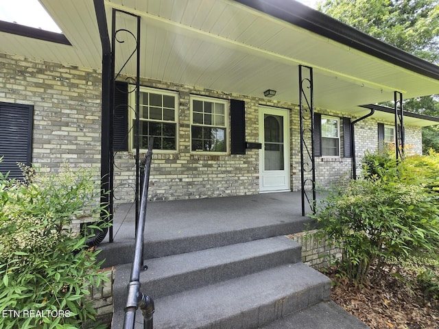 114 Verdun Rd, Oneida, TN 37841 - view of exterior entry with a porch and brick siding