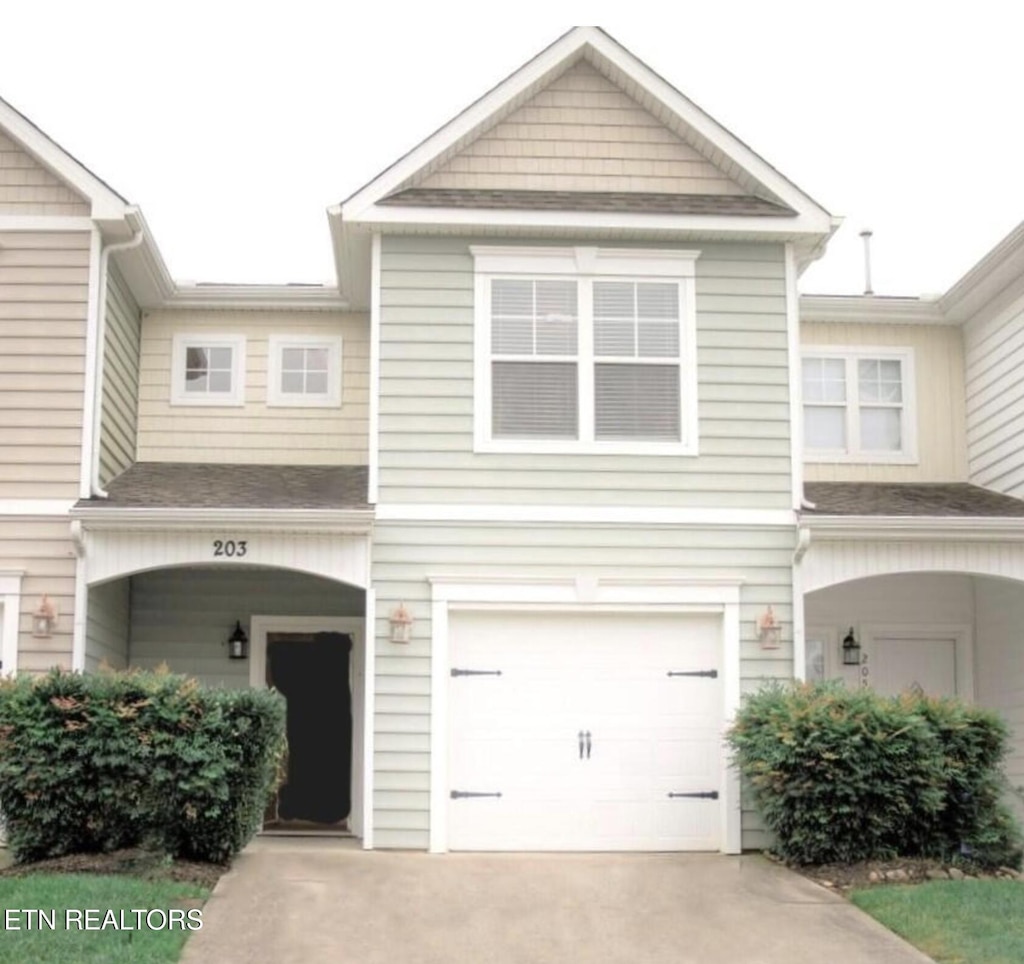 203 Bar Tall Way, Seymour, TN 37865 - view of front of home with a garage, concrete driveway, and a shingled roof