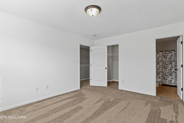 203 Bar Tall Way, Seymour, TN 37865 - unfurnished bedroom featuring carpet floors, a closet, connected bathroom, and a spacious closet