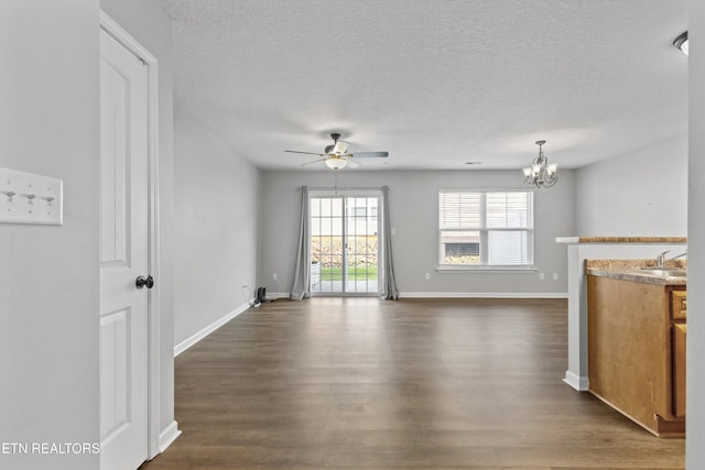 203 Bar Tall Way, Seymour, TN 37865 - unfurnished living room featuring ceiling fan, dark wood-style floors, a chandelier, and a textured ceiling