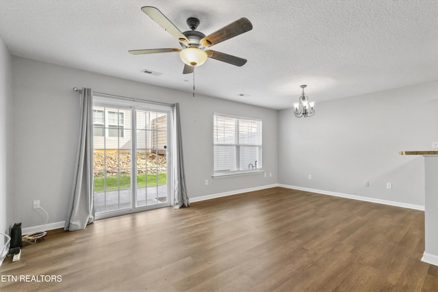 203 Bar Tall Way, Seymour, TN 37865 - unfurnished room featuring wood finished floors, a chandelier, ceiling fan, and a textured ceiling