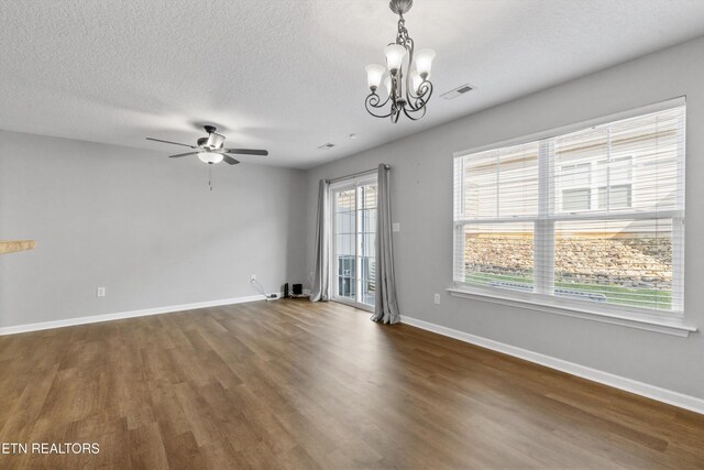 203 Bar Tall Way, Seymour, TN 37865 - spare room with dark wood-style floors, ceiling fan, a chandelier, and a textured ceiling