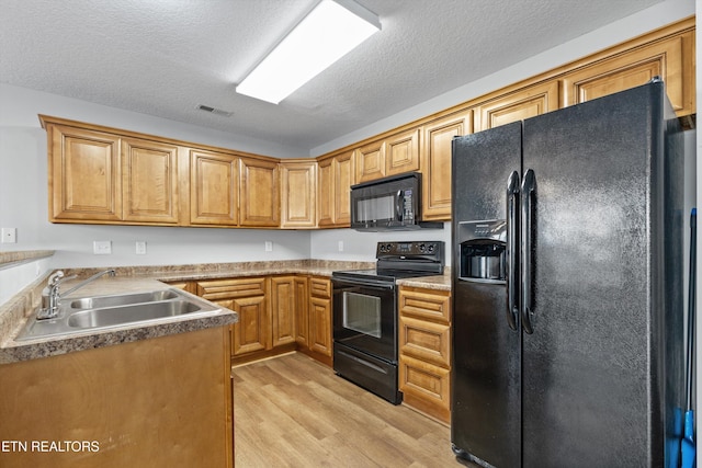 203 Bar Tall Way, Seymour, TN 37865 - kitchen with black appliances, light wood finished floors, and a textured ceiling