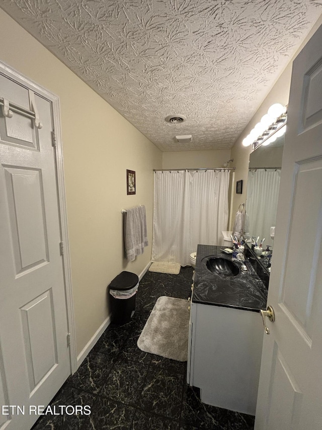 2726 Kentwood Dr, Kodak, TN 37764 - full bath featuring marble finish flooring, vanity, baseboards, a shower with shower curtain, and toilet