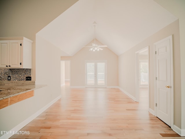 116 Deer Path Trl, Vonore, TN 37885 - unfurnished living room with light wood finished floors, a ceiling fan, baseboards, and lofted ceiling