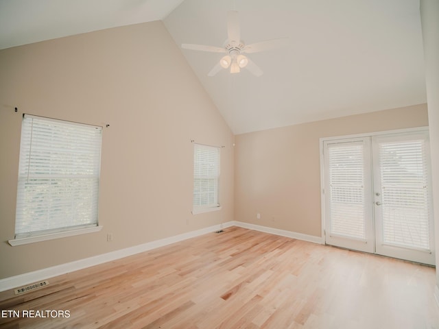 116 Deer Path Trl, Vonore, TN 37885 - spare room with a ceiling fan, high vaulted ceiling, healthy amount of natural light, light wood-style floors, and baseboards