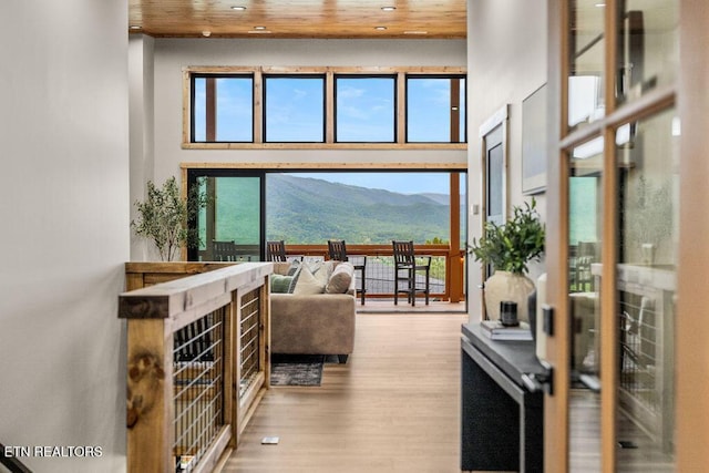 2634 Whipoorwill Hill Way, Sevierville, TN 37862 - living room featuring a mountain view, a towering ceiling, wood finished floors, plenty of natural light, and wood ceiling