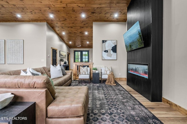 2634 Whipoorwill Hill Way, Sevierville, TN 37862 - living area featuring a glass covered fireplace, wood finished floors, wooden ceiling, and recessed lighting