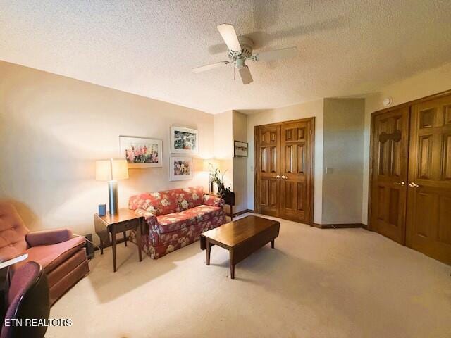 128 Cathedral Dr, Crossville, TN 38558 - carpeted living area featuring a ceiling fan and a textured ceiling