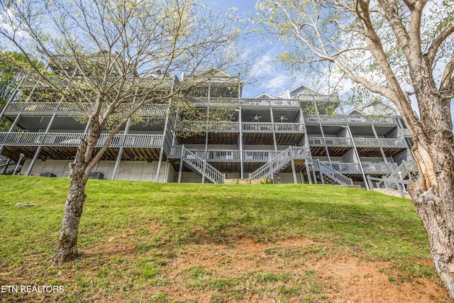 245 Doe Ln Unit 5, Lafollette, TN 37766 - rear view of property featuring stairway, a yard, and a wooden deck