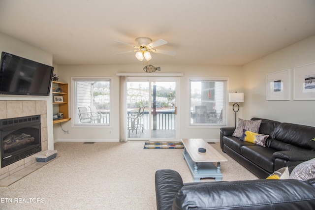 245 Doe Ln Unit 5, Lafollette, TN 37766 - living room featuring ceiling fan, carpet flooring, baseboards, and a fireplace