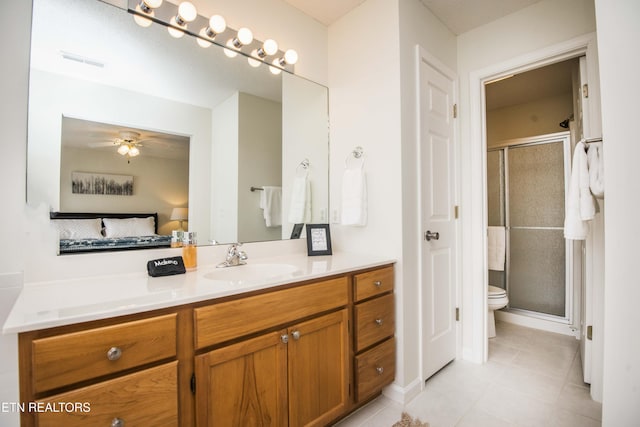 245 Doe Ln Unit 5, Lafollette, TN 37766 - ensuite bathroom featuring vanity, tile patterned floors, toilet, a shower stall, and a ceiling fan