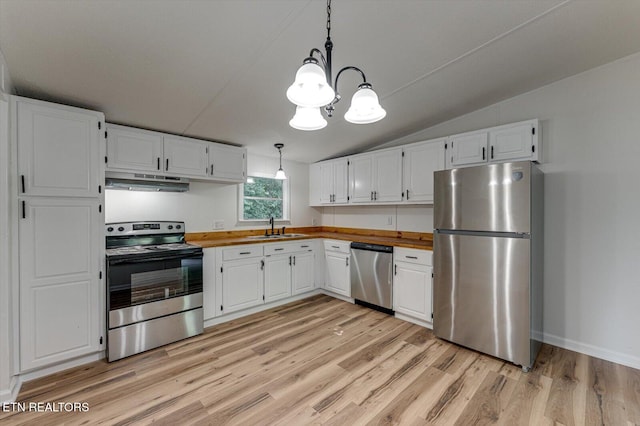 135 Mt View Rd, Sweetwater, TN 37874 - kitchen with stainless steel appliances, under cabinet range hood, light wood-style floors, white cabinets, and a chandelier