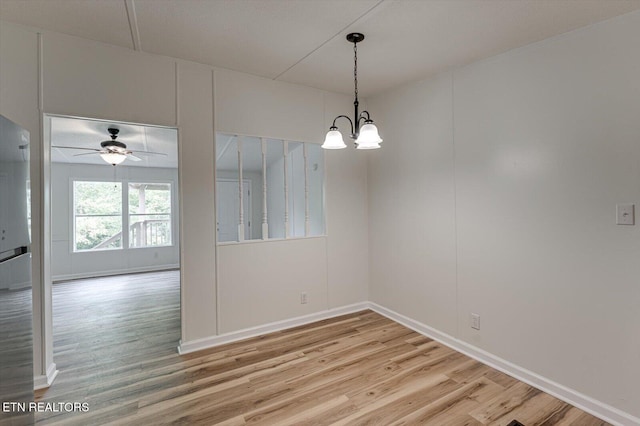 135 Mt View Rd, Sweetwater, TN 37874 - unfurnished room featuring light wood finished floors, a ceiling fan, and a chandelier