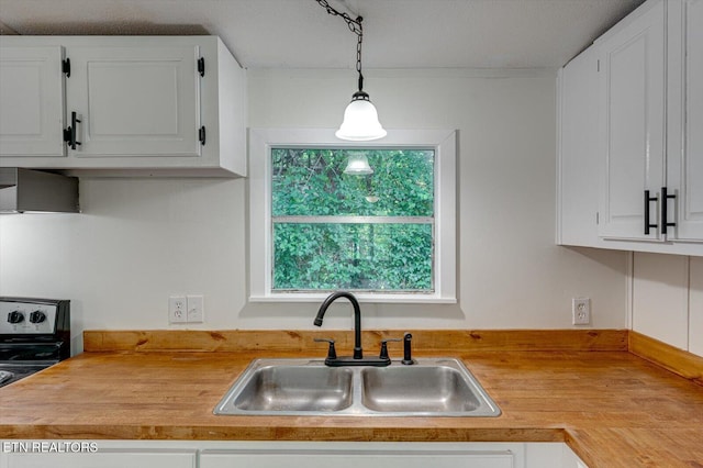 135 Mt View Rd, Sweetwater, TN 37874 - kitchen with electric range oven, white cabinets, light countertops, and hanging light fixtures