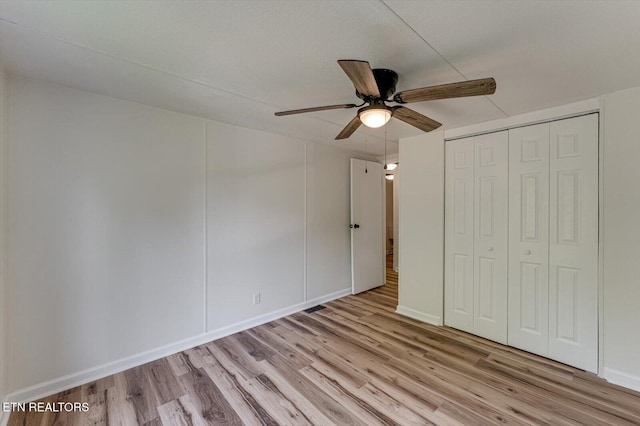 135 Mt View Rd, Sweetwater, TN 37874 - unfurnished bedroom with wood finished floors, a closet, and ceiling fan
