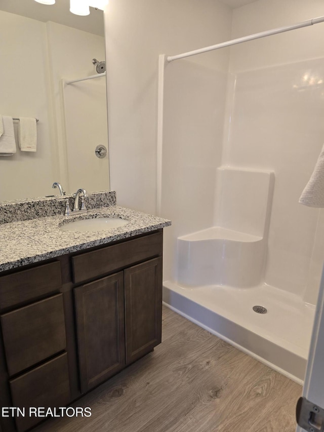 1334 Mountain Quail Cir, Maryville, TN 37801 - full bathroom featuring wood finished floors, a shower, and vanity