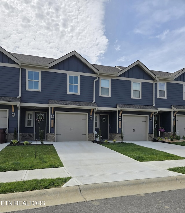 1334 Mountain Quail Cir, Maryville, TN 37801 - view of property with board and batten siding, an attached garage, and driveway