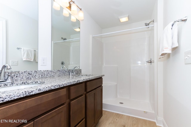 1334 Mountain Quail Cir, Maryville, TN 37801 - full bath with a shower, wood finished floors, and double vanity