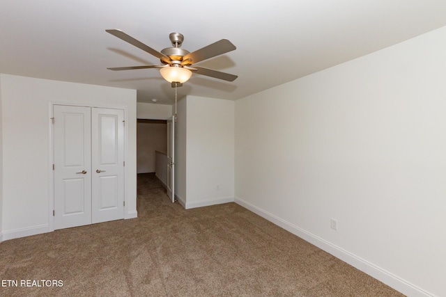 1334 Mountain Quail Cir, Maryville, TN 37801 - unfurnished bedroom featuring carpet floors, a closet, and ceiling fan
