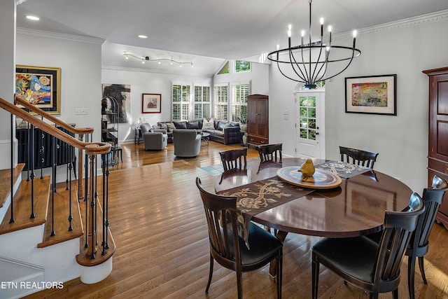 8940 Kelsey Ln, Knoxville, TN 37922 - dining room featuring a chandelier, ornamental molding, wood finished floors, stairway, and recessed lighting