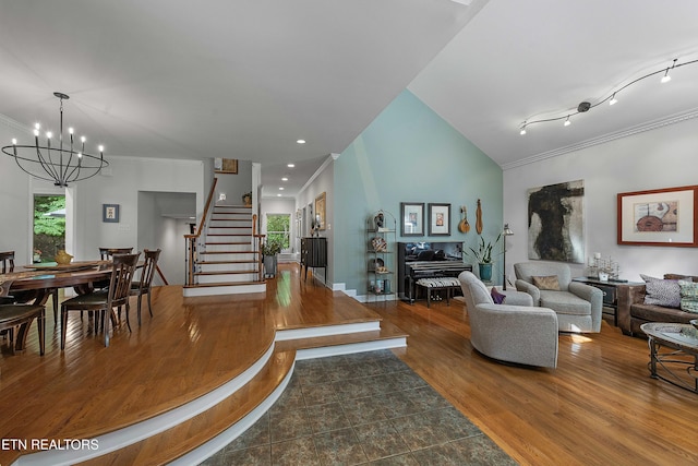 8940 Kelsey Ln, Knoxville, TN 37922 - living area with a chandelier, healthy amount of natural light, wood finished floors, stairs, and crown molding