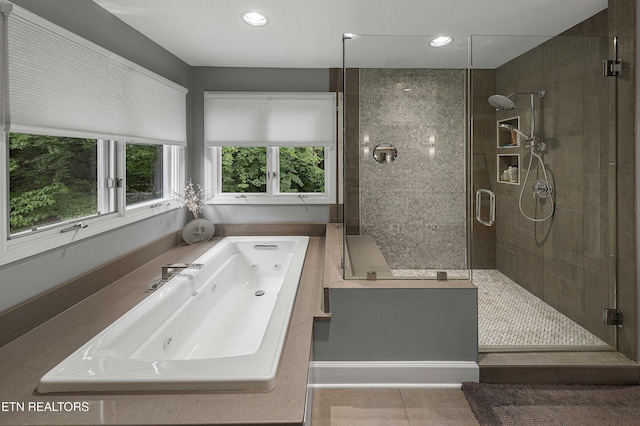 8940 Kelsey Ln, Knoxville, TN 37922 - full bath with a whirlpool tub, plenty of natural light, a stall shower, tile patterned flooring, and recessed lighting