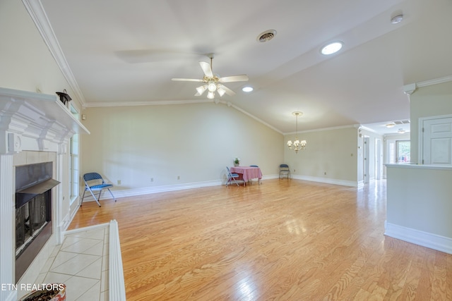 674 Applegate Ln Unit 32, Knoxville, TN 37934 - unfurnished living room with a tiled fireplace, ceiling fan, a chandelier, light wood-style floors, and crown molding