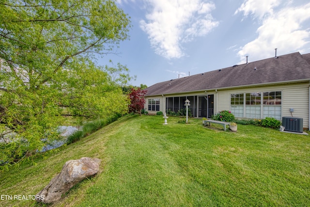 674 Applegate Ln Unit 32, Knoxville, TN 37934 - view of grassy yard with central AC and a sunroom