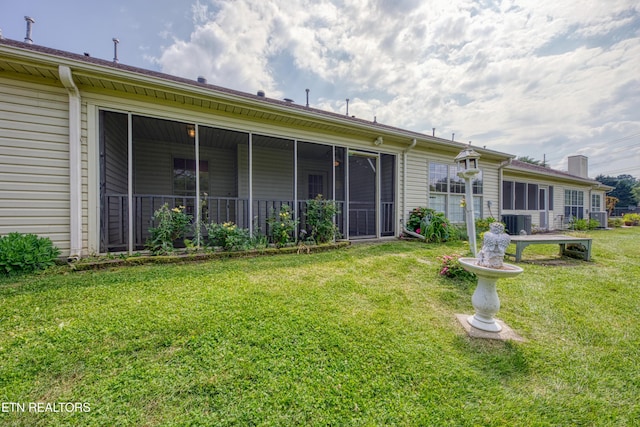 674 Applegate Ln Unit 32, Knoxville, TN 37934 - back of house featuring a lawn, central air condition unit, and a sunroom