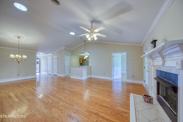 674 Applegate Ln Unit 32, Knoxville, TN 37934 - unfurnished living room featuring a fireplace, ceiling fan, a chandelier, light wood-type flooring, and ornamental molding