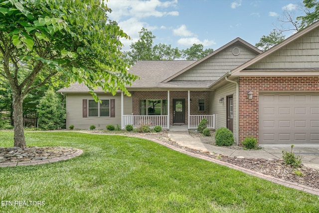 15 Chatham Ct, Fairfield Glade, TN 38558 - view of front of home with a porch, an attached garage, brick siding, a front lawn, and driveway
