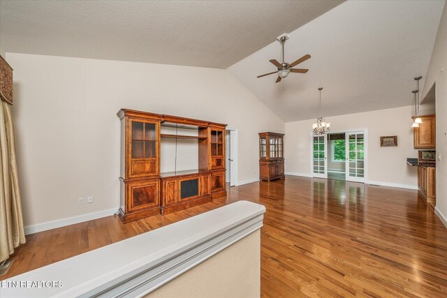 15 Chatham Ct, Fairfield Glade, TN 38558 - living room featuring a ceiling fan, a chandelier, wood finished floors, and high vaulted ceiling
