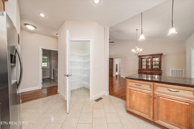 15 Chatham Ct, Fairfield Glade, TN 38558 - kitchen featuring stainless steel fridge with ice dispenser, a chandelier, light tile patterned flooring, decorative light fixtures, and recessed lighting