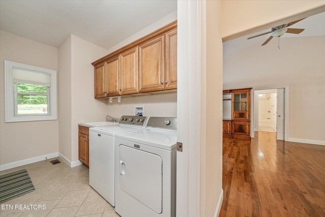 15 Chatham Ct, Fairfield Glade, TN 38558 - laundry room with cabinet space, washer and clothes dryer, ceiling fan, and light wood-type flooring