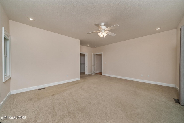 15 Chatham Ct, Fairfield Glade, TN 38558 - spare room featuring light carpet, ceiling fan, recessed lighting, and a textured ceiling