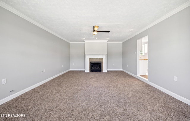 165 Kenzie Ln, Lafollette, TN 37766 - unfurnished living room with a ceiling fan, a textured ceiling, carpet floors, a fireplace, and crown molding