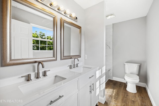 165 Kenzie Ln, Lafollette, TN 37766 - bathroom featuring double vanity, wood finished floors, and a tub